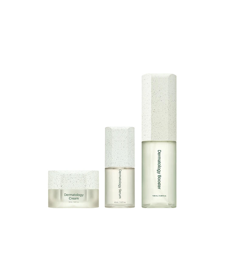 Minimalist Korean skincare set featuring Dermatology Serum, Booster, and Cream in frosted glass packaging with white speckled caps.